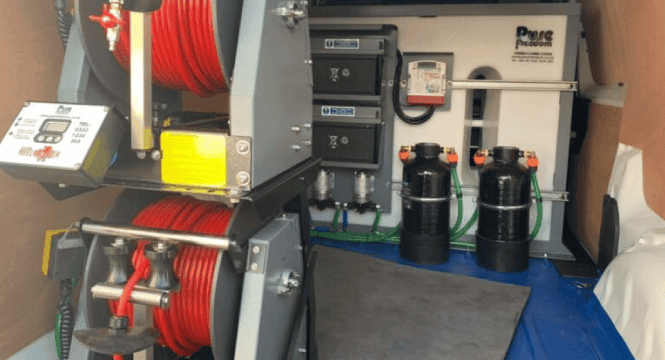Inside Neptune's van with their cleaning equipment for atriums.