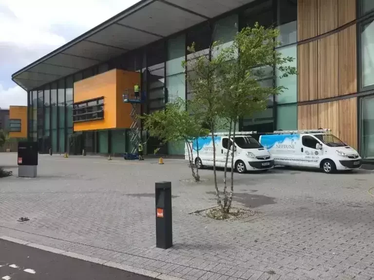Neptune Window Cleaning vans outside of a B&Q.